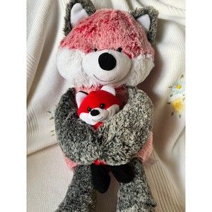 Red Mama Fox holding her Baby